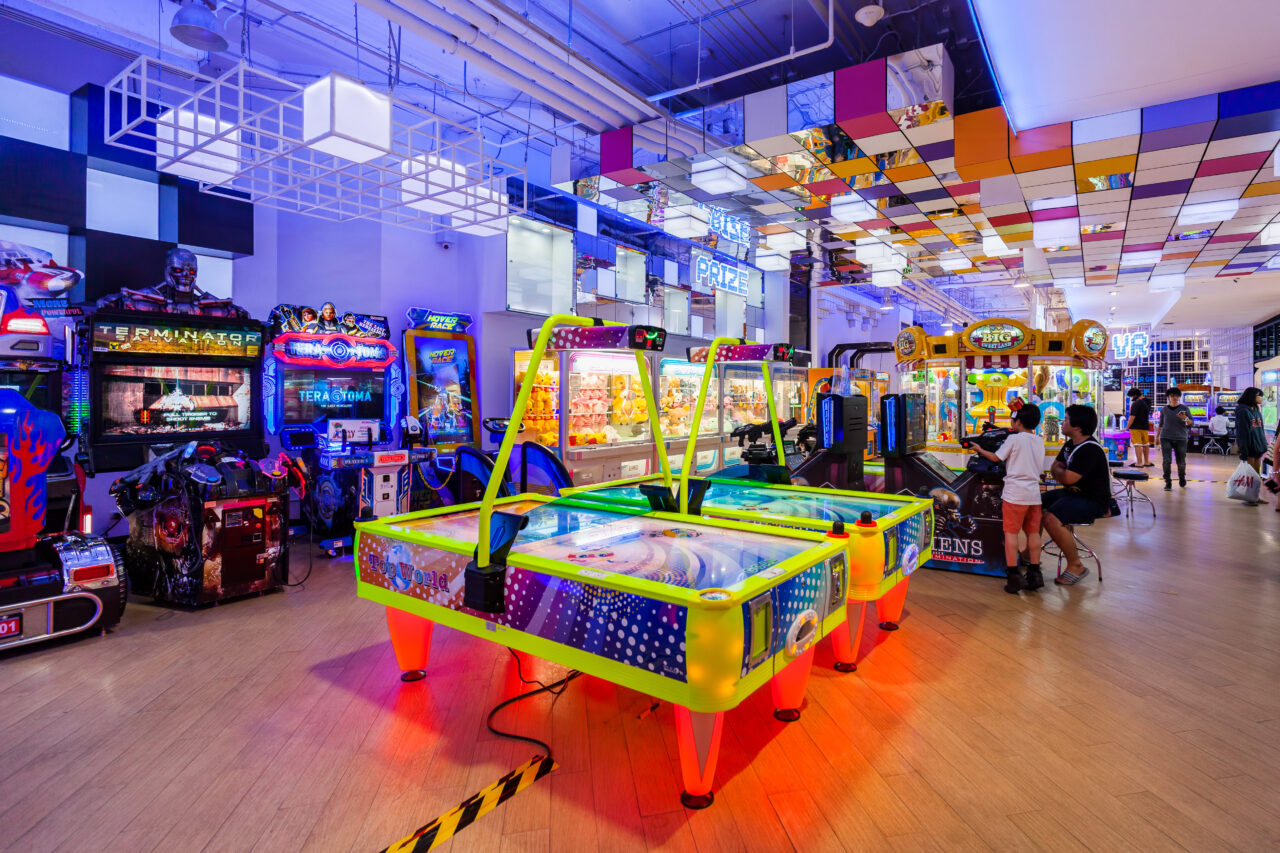 Bright arcade games light up at Warp Zone Game Center in Bangkok Thailand.