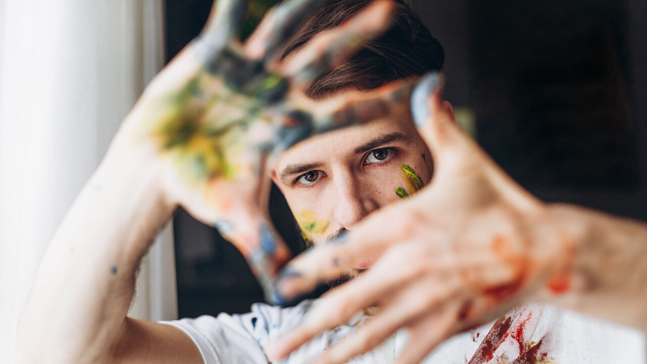 Painter framing with hands.