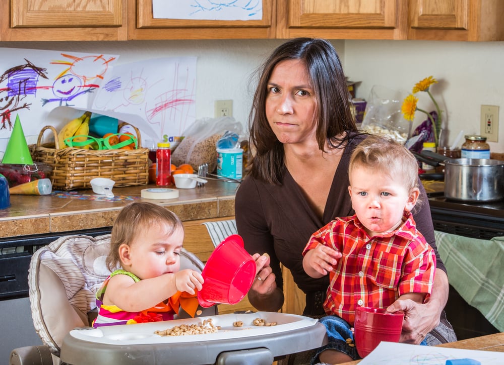 Stressed,Out,Mother,In,Kitchen,With,Her,Babies