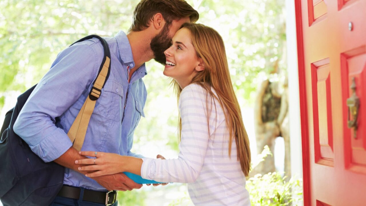 Man kissing goodbye to wife